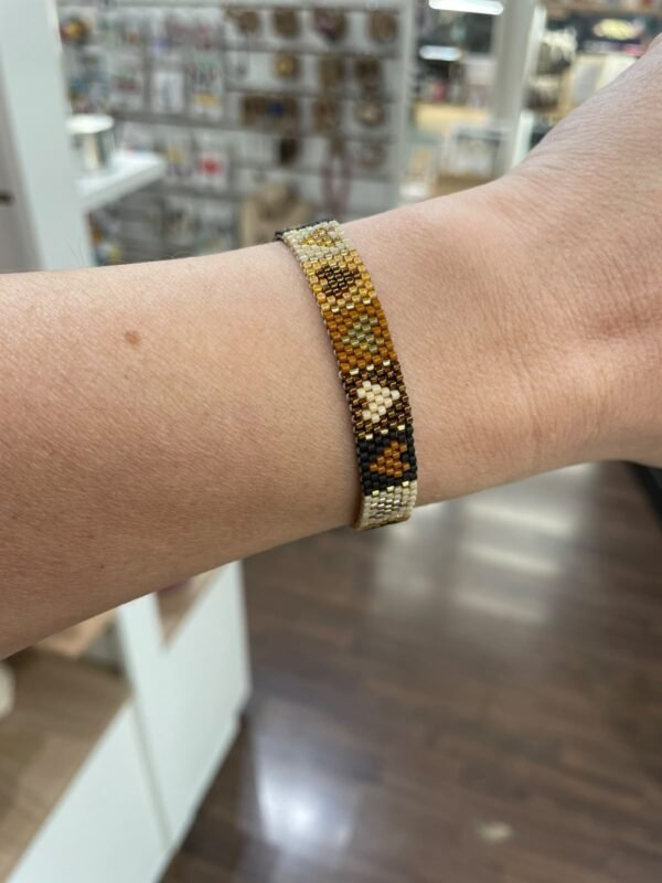 Pulsera corazones negro/marrón